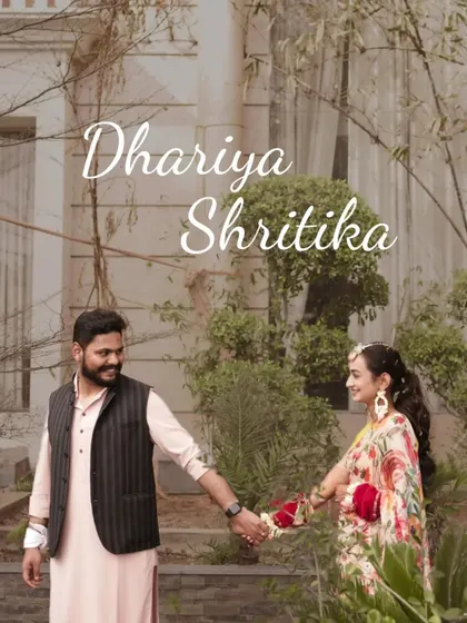A romantic shot of the couple holding hands and walking in a garden setting during their Haldi event.