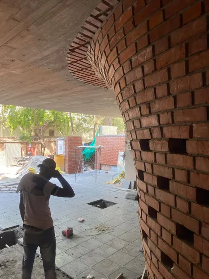 A detail shot of the curved brickwork, showing the precision required to create this sculptural, light-filtering element.