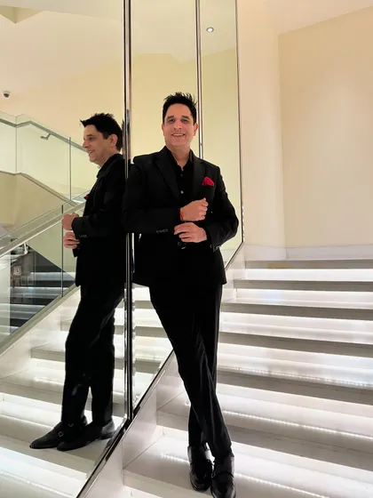 A classic, confident pose ready for the wedding season. The reflection in the mirror adds a touch of artistic flair.