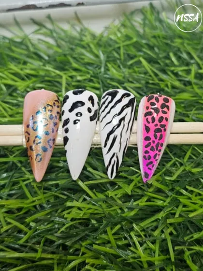 Unleash your wild side with these animal print designs. This set showcases different variations, from classic leopard and zebra to a vibrant pink and a shimmery chrome leopard print.