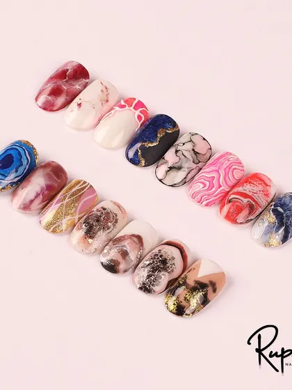 My full marble nail art course portfolio. It covers a wide range of styles, from classic stone effects to colorful, abstract patterns.