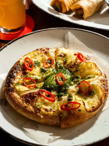 An angled shot of the same potato pizza, showing how we capture multiple perspectives for client flexibility.