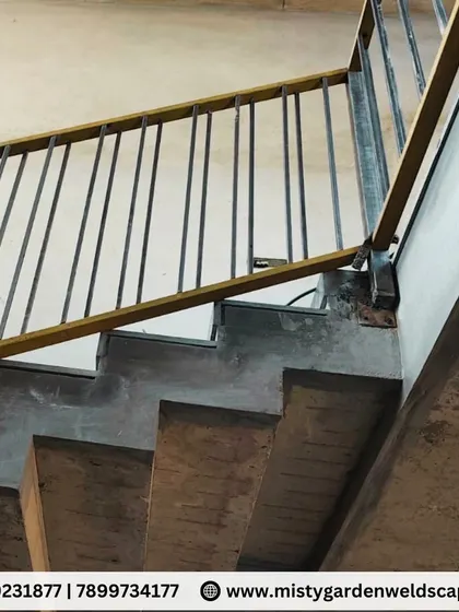 A close-up of the staircase railing's mounting point. I ensure every connection is securely welded and finished to provide a safe and sturdy structure that you can rely on.