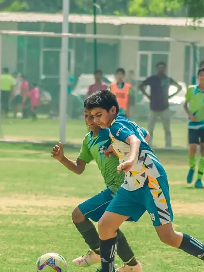 A fast-paced chase for the ball on a sunny day.