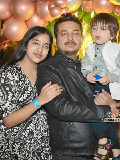 A father with his two children at a family event. We capture both large group shots and smaller family groupings throughout the day.