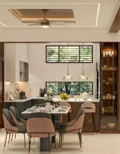 This image shows a dining table placed adjacent to the kitchen, framed by a custom storage and display unit. It demonstrates how I integrate dining and kitchen areas seamlessly.