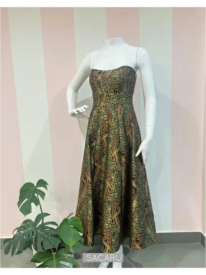 The full view of the strapless paisley brocade dress on a mannequin, highlighting its elegant structure.
