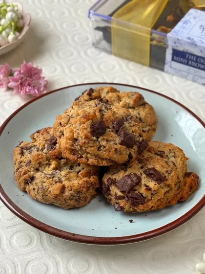 A simple, beautiful shot of my Levain Style Chocolate Walnut Cookies, piled high on a plate. You can see the generous chocolate chunks and the perfectly baked, golden-brown texture.