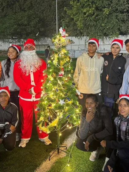 Our girls' team celebrating Christmas at the academy. We foster a strong sense of family and community among our players, creating a supportive home away from home.