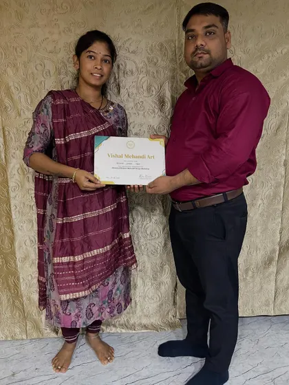 Presenting a certificate of completion to a dedicated student. Seeing them ready to take on professional work is my biggest reward as a teacher.