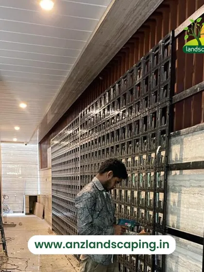 Our technician works on the installation of a vertical garden framework, demonstrating the meticulous process of setting up the structure that holds the planters.