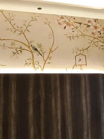 A delicate chinoiserie wallpaper installed on a complex wall with a curved corner and integrated backlighting. I ensured the pattern flowed seamlessly around the bend.