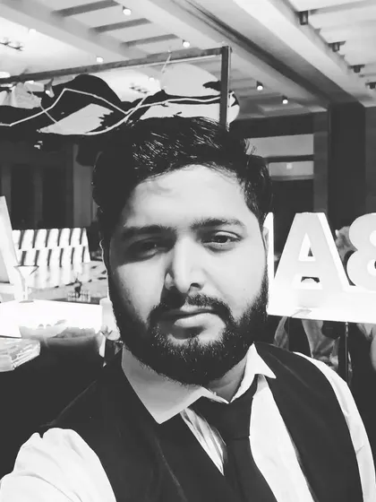 A quick photo of me, Amit, at an event. I personally oversee the details to make sure your bar experience is perfect.
