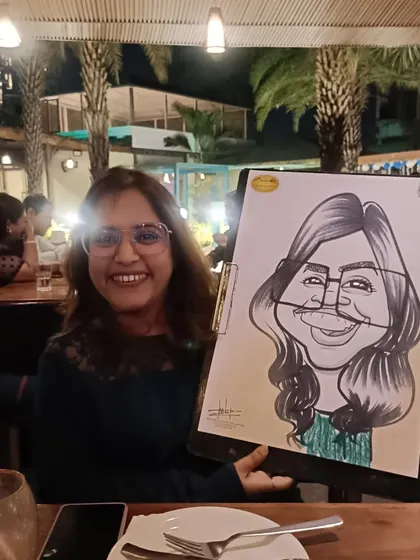 A happy guest at Mountain High restaurant. I'm there on weekends to draw diners.