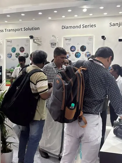 Visitors getting a hands-on look at my camera hardware at AutoSec 2025. I believe in letting the quality and design of my products speak for themselves.