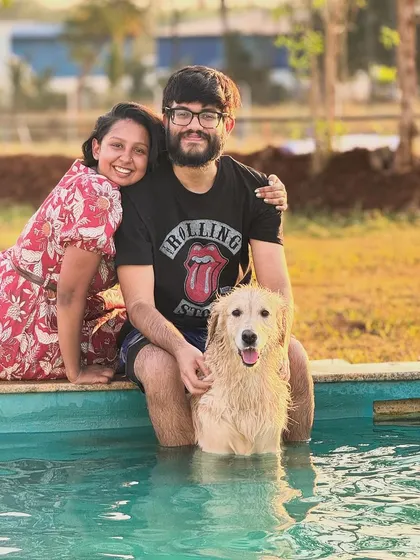 A happy family portrait right in the pool! We love capturing these moments of shared joy between pets and their parents.