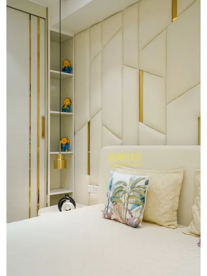 This image shows the clever use of space in the Tata LaVida bedroom, with built-in open shelving next to the bed for display and easy access to nighttime essentials.