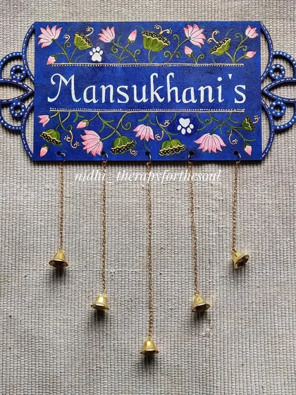 A variation of the lotus-themed nameplate, this one for the 'Mansukhani's' uses a beautiful royal blue. I also added little paw prints as a sweet nod to the family's pet.