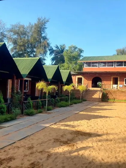 The comfortable and clean beachside cottages at our Gokarna stay.