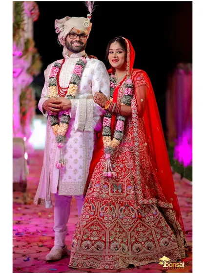 A classic full-length portrait of the bride and groom.