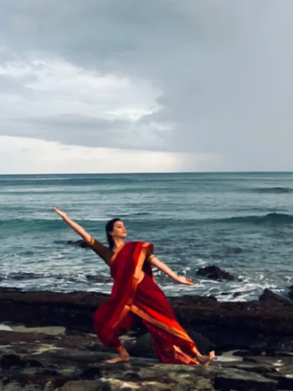 Feeling a sense of oneness with the universe while dancing on the rocky shores of Reunion Island. This image captures the spiritual connection between my art and nature.