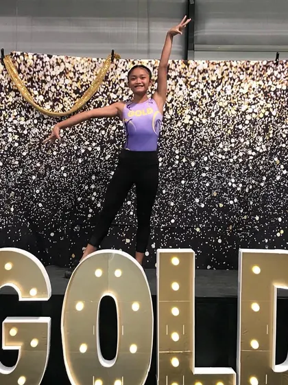 An elegant pose from one of our Xcel Gold gymnasts at the regional championships.