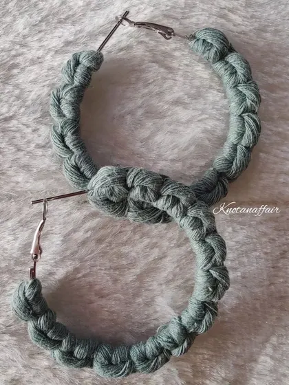 A beautiful pair of sage green macrame hoop earrings that were part of a special custom order. These are stylish, unique, and handmade with love.