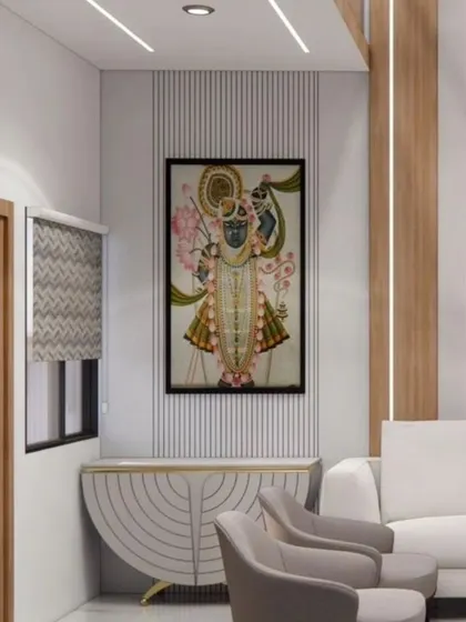 A design concept showing how to incorporate traditional art into a modern living room. The pichwai painting is flanked by simple wall paneling, creating a beautiful blend of culture and contemporary style.