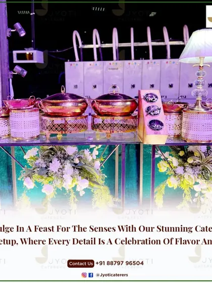 A chic and modern buffet counter with woven pink accents and copper-lidded serving dishes, illuminated by a stylish table lamp.