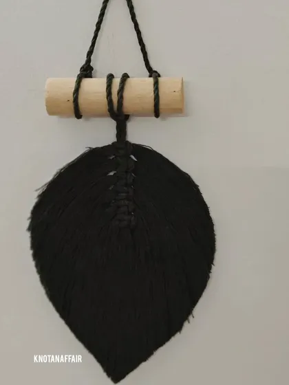 A classic black macrame leaf. This was another piece from a custom bulk order. Hung on a wooden dowel, it makes a simple and elegant wall hanging.