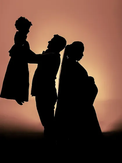 A creative silhouette shot of the family. Even without seeing the details, the hairstyling and the veil I added for the mother create a beautiful and recognizable outline.