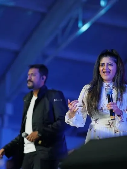Sharing a laugh on stage. It's not just about singing; it's about creating a joyful and interactive experience for the audience.