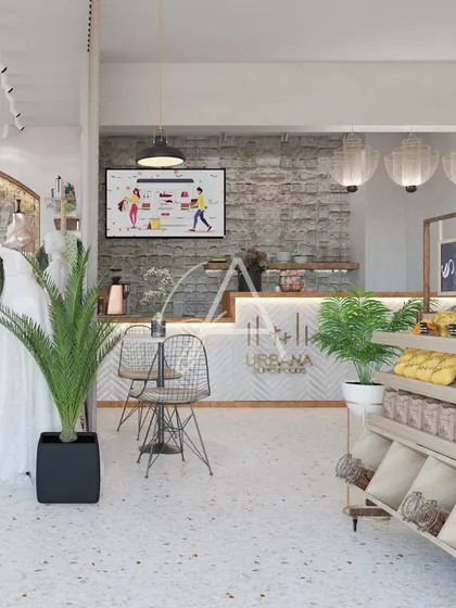 This part of the store integrates a small cafe and organic food section. The design maintains the store's aesthetic while clearly defining a separate zone for a different type of shopping experience.