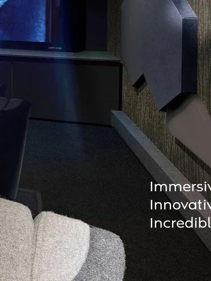 A closer look at the design elements of our "Entertainment Reimagined" concept. Notice the textured wall panels for acoustic treatment, the precise placement of recessed ceiling lights, and the comfortable, fabric-upholstered cinema seats.