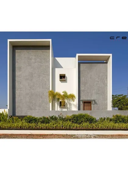 The 'Framed House' elevation is a study in parallel forms, with two primary volumes creating a strong, symmetrical, and minimalist composition.