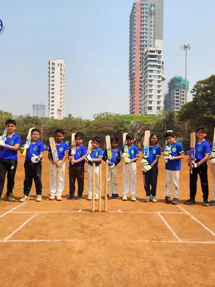 Our junior cricket team stands ready on the pitch. This photo captures their unity and readiness to face any challenge as a cohesive unit.