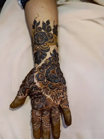 The same bridal design from a slightly different angle, showing how the pattern wraps around the hand and arm.
