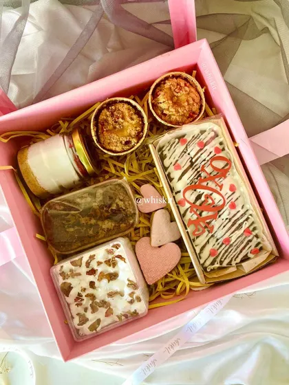 A Valentine's Day hamper filled with a variety of sweet treats. Every bite is a celebration of love.