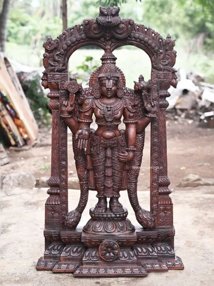 A recently sold 48-inch (4-foot) standing Tirupathi Balaji statue with an arch design. The dark wax brown finish gives it a timeless, antique quality, emphasizing the powerful and serene presence of the deity.