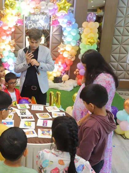 Explaining a picture-based guessing game to the kids. I use a mix of physical and mental games to cater to different interests.