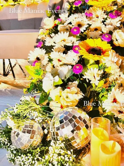 Another detail shot of the floral couch, focusing on the disco balls and candles. This shows how I use unique props to enhance the overall theme and add a bit of sparkle.
