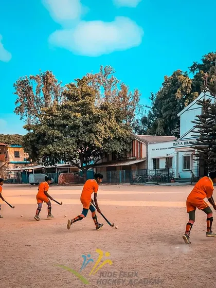 The heart of hockey is born on grounds like this. A line of our young players at a summer camp, practicing their dribbling, perfectly captures the focus and dedication we instill from day one.