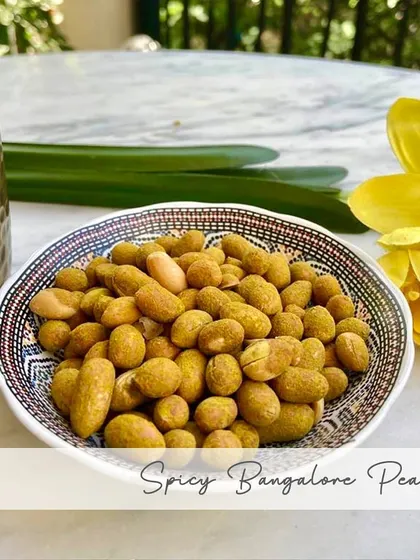 My Spicy Bangalore Peanuts are a local favorite. I coat fresh peanuts in a blend of red and green chillies, turmeric, and hing, then roast them for a perfectly spicy and crunchy bite.