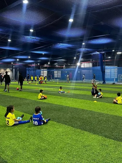 A wide view of our indoor facility where our youngest players are spread out for a drill. The spacious and safe environment is perfect for kids to run and play freely.