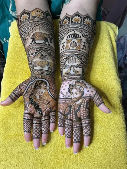 Full view of a personalized bridal mehandi featuring detailed portraits of the bride and groom on each palm, ready for their big day.