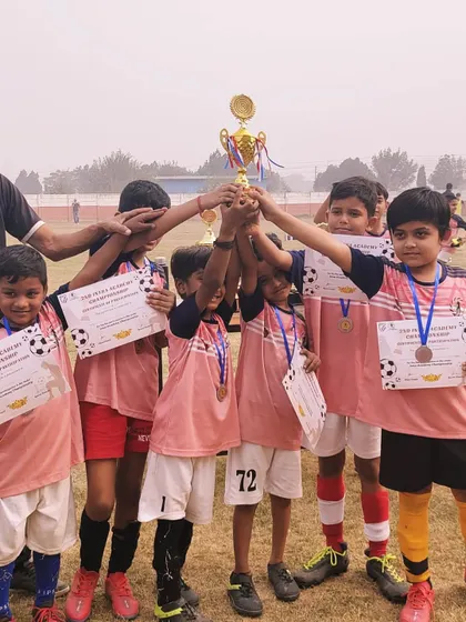 Our youngest champions. The Under-9 team with their medals and trophy, beaming with pride after a successful intra-academy tournament.
