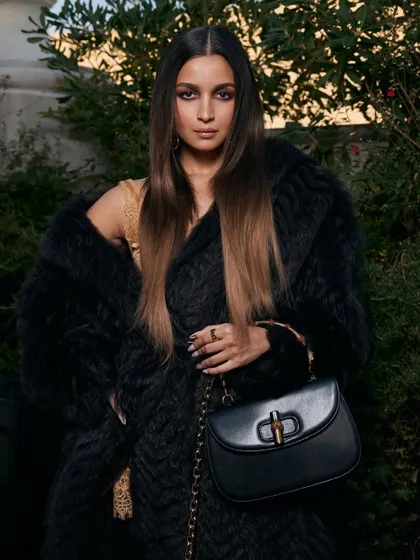 Another angle of Alia Bhatt's chic look for The Tiger premiere. The straight, center-parted hair is modern and powerful, perfectly framing her face and complementing the structured fashion.