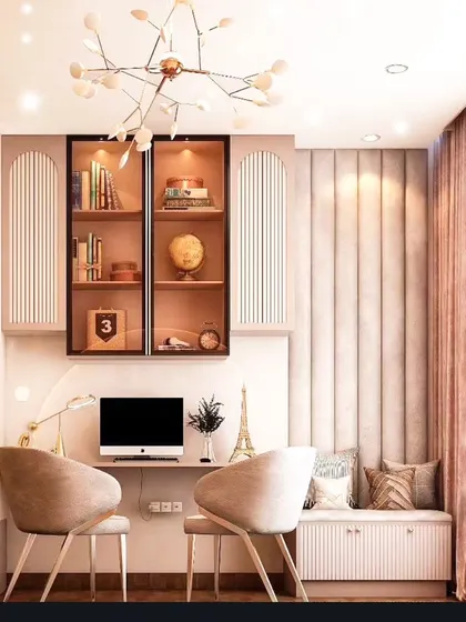 Another view of the elegant study area, showcasing the soft pink color palette and fluted wall paneling. The arched shelving and modern chairs create a stylish and comfortable space for learning or reading.