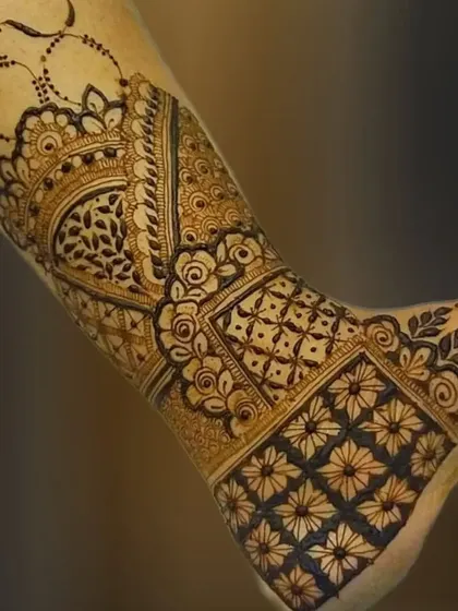 A close-up showing the intricate detail on the side of the hand. I use a mix of floral and geometric patterns to create a rich texture.