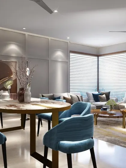 A render of a cozy living and dining room with a subtle color palette and ample lighting. The design uses a beautiful carpet to separate the seating and dining areas, while art pieces add a touch of pizzazz.